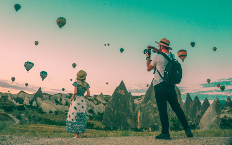 Man taking picture of woman in Cappadocia